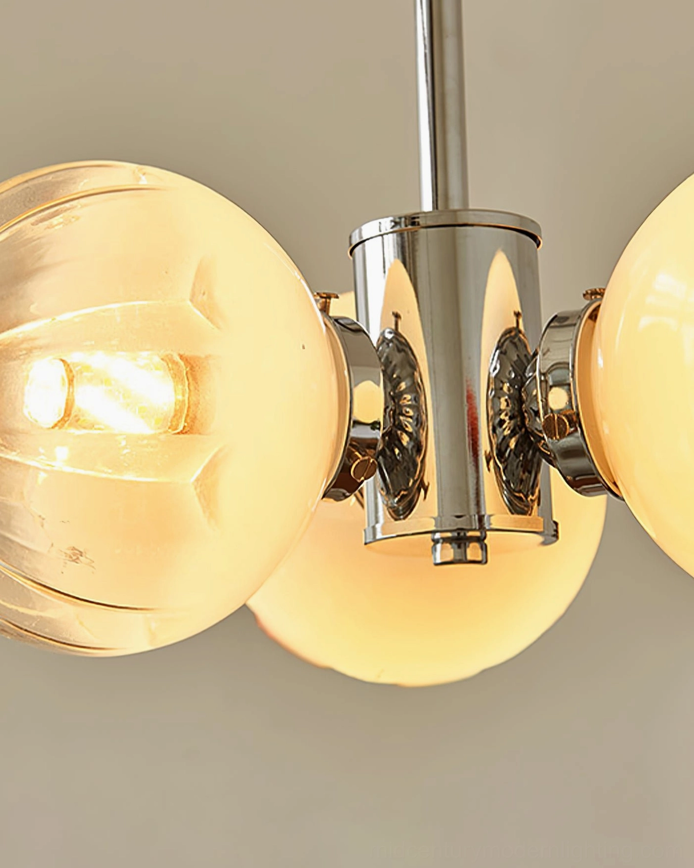 Flower Bud Chandelier illuminated showing warm amber light diffusion through glass petal shades