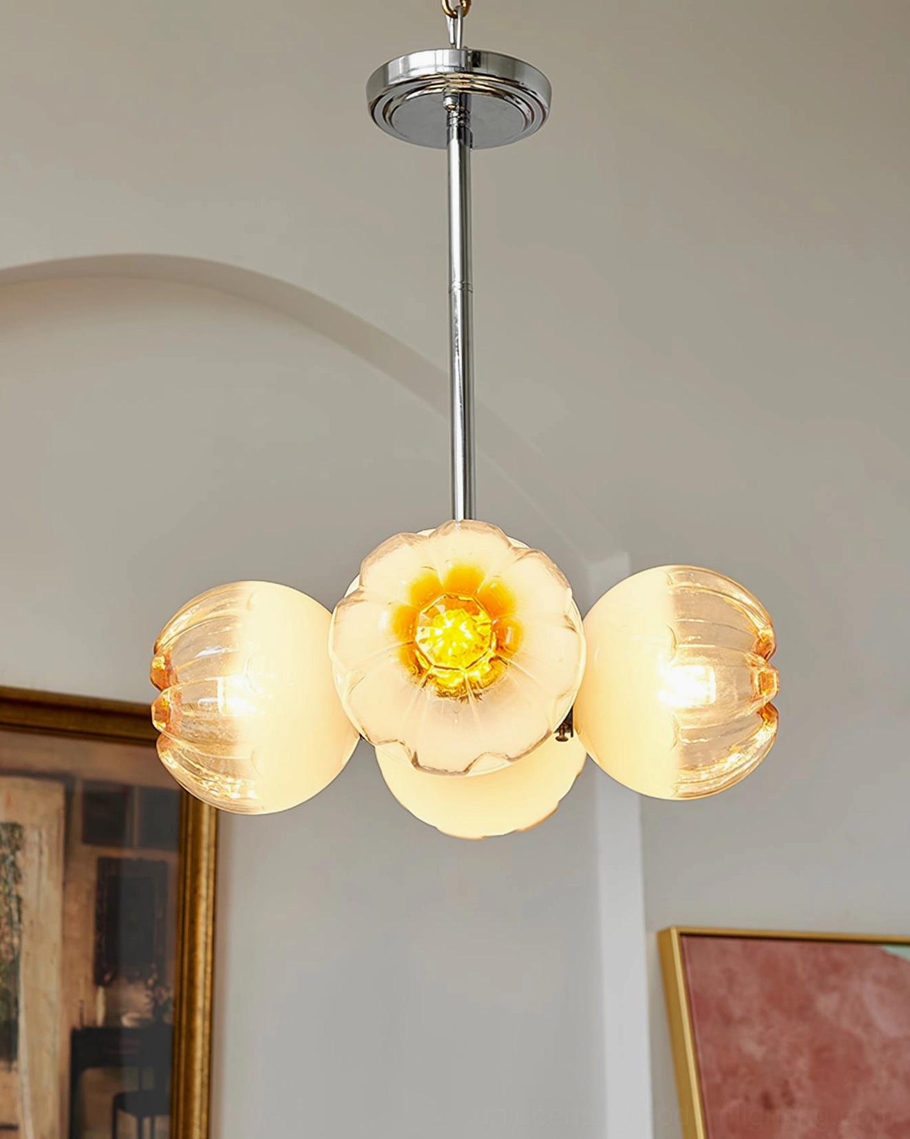 Flower Bud Chandelier low-angle view with central full bloom glass shade surrounded by amber petals in classical interior