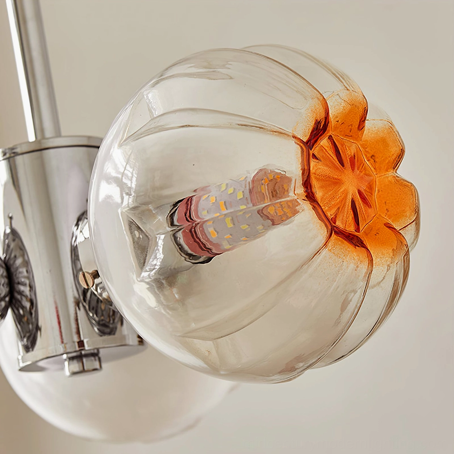 Flower Bud Chandelier overhead view showing three polished chrome heads with amber glass blooms