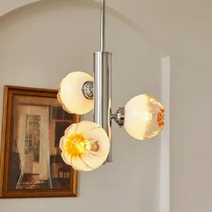 3-head Flower Bud Chandelier hanging in vintage French interior with warm amber glowing glass shades
