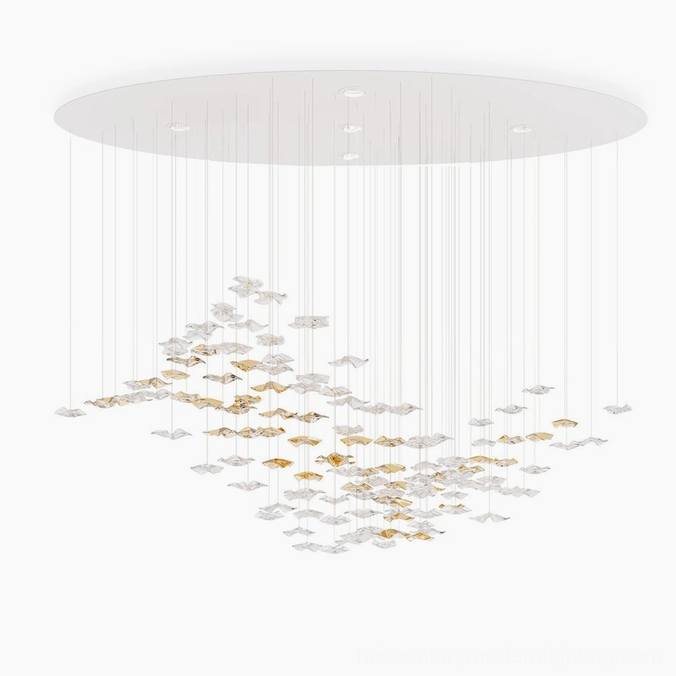 Modern fluid glass chandelier with cascading clear and golden pendants overhead flat view minimalist design