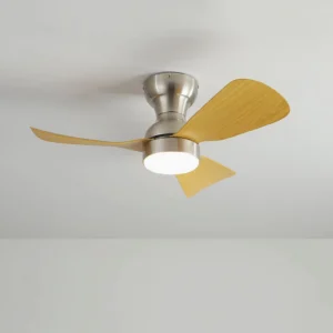 Integrated LED ceiling fan light installed flush to white ceiling, bottom-up perspective showing light wood blades and round LED lamp module in empty room