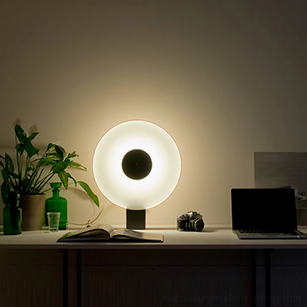 Flying Saucer LED lamp on home office desk with modern decor, plants, and electronics, workspace view
