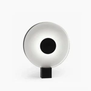 Round Flying Saucer LED table lamp with black and white matte finish, front view against minimalist studio background