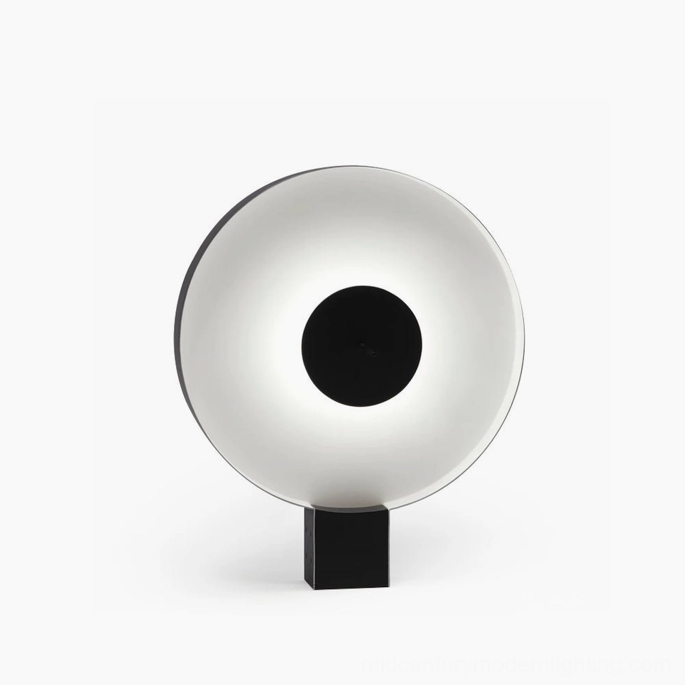 Round Flying Saucer LED table lamp with black and white matte finish, front view against minimalist studio background