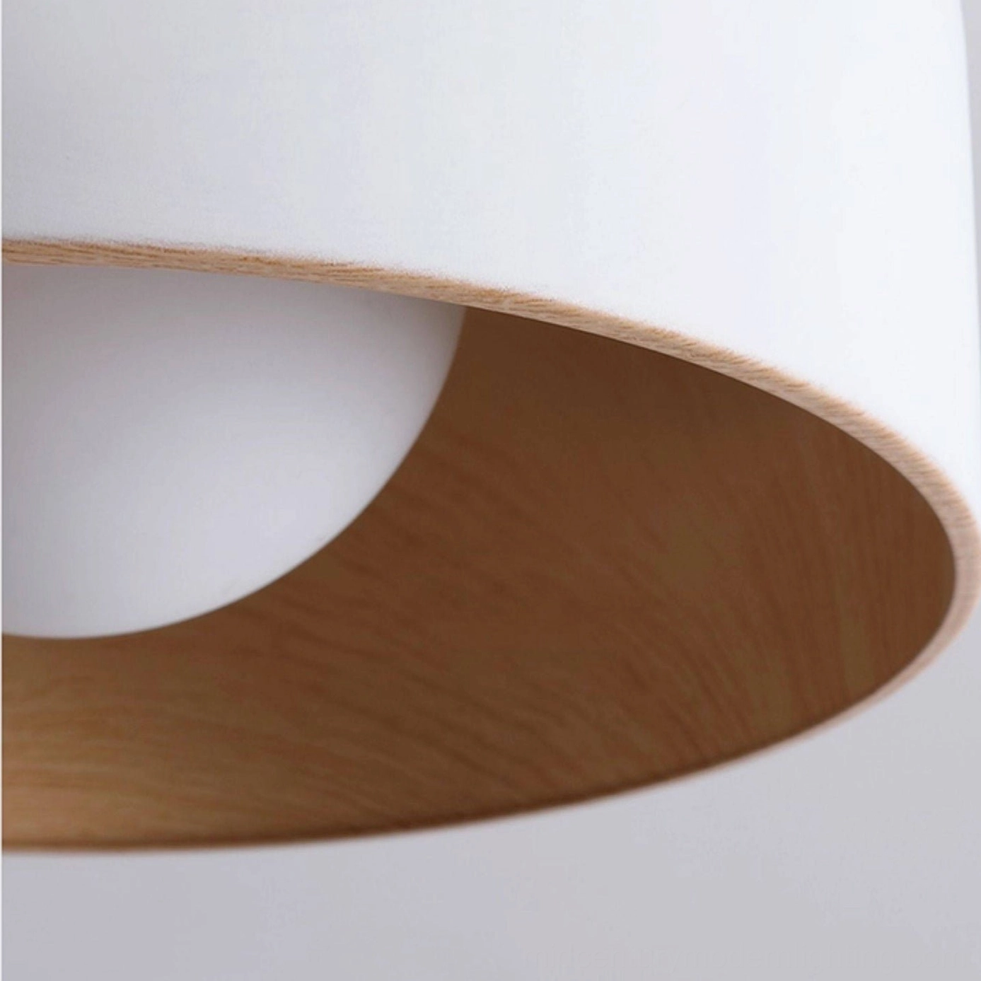 Folkio flush mount ceiling light architectural detail shot showcasing geometric form and material finish