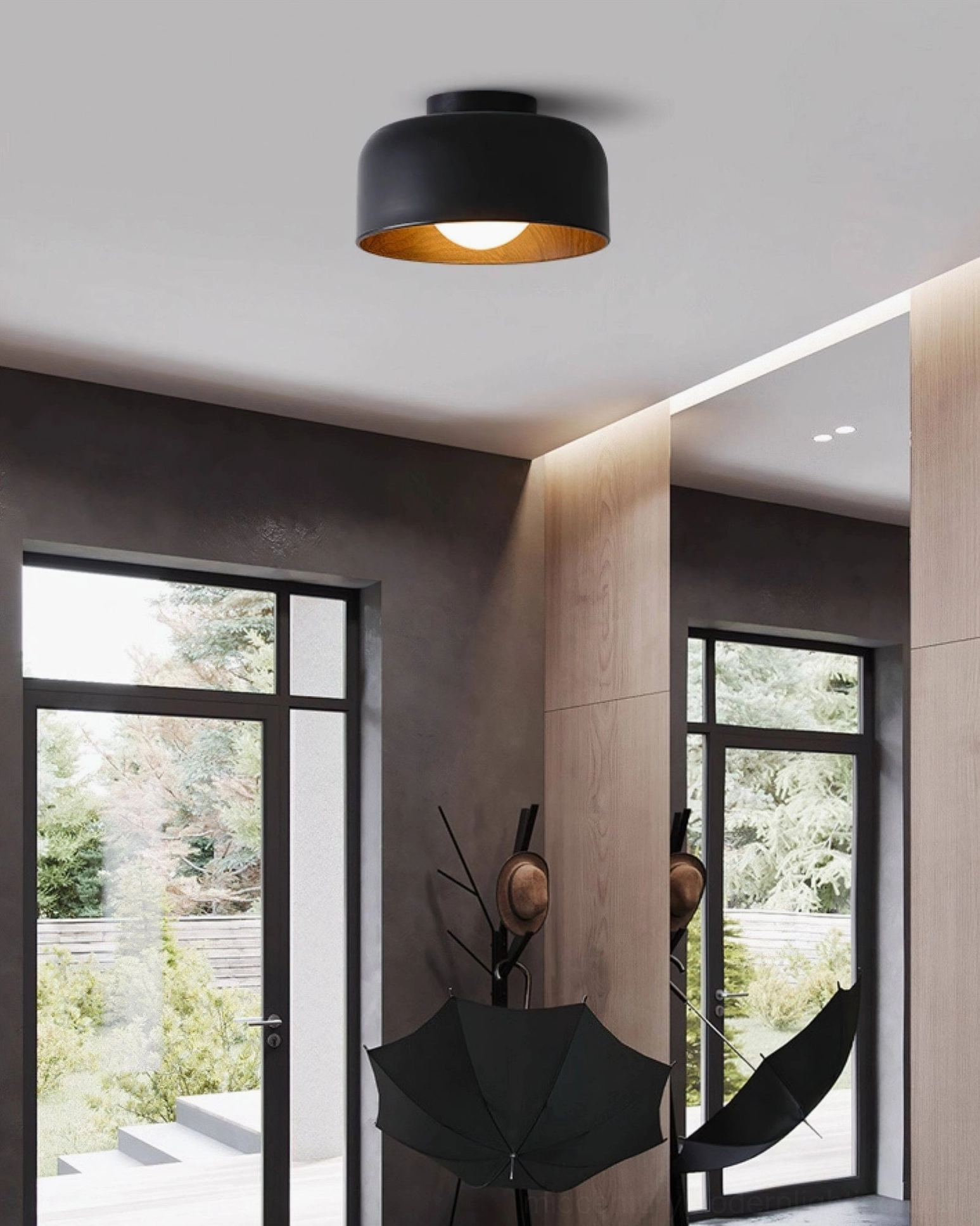 Single Folkio black matte ceiling light mounted in contemporary living room with neutral color palette