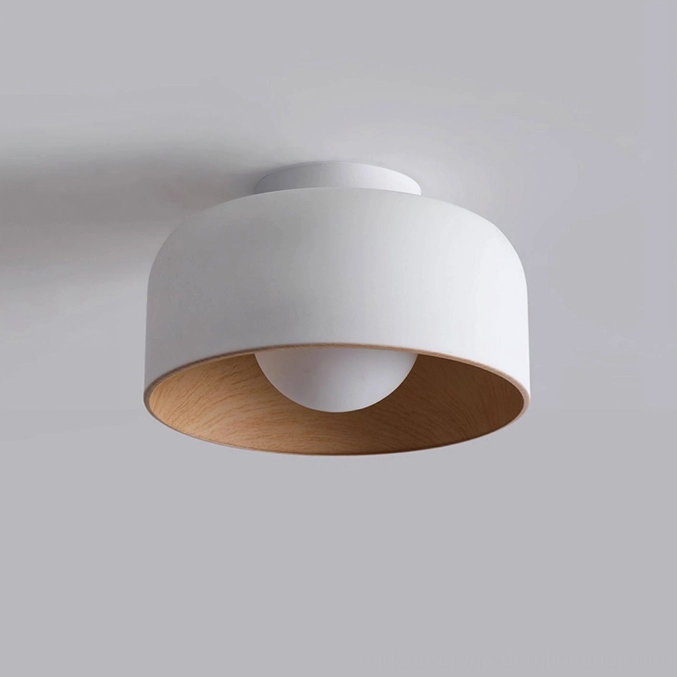 Folkio ceiling light in white matte finish with warm wood grain detail, studio close-up photograph