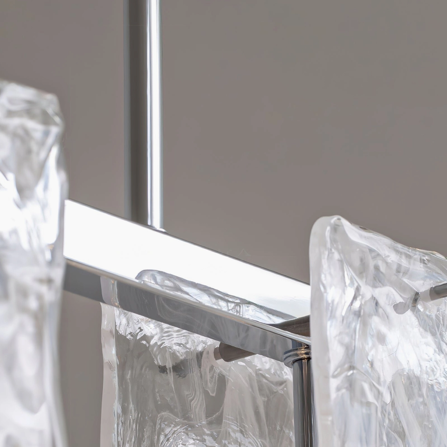 Fontaine sculptural glass chandelier with chrome metal finish, modern pendant lighting design detail view