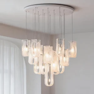 Fontaine modern chandelier suspended in minimalist interior with sheer curtains, warm glowing LED light casting soft shadows