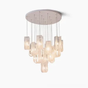 Fontaine cascading glass chandelier with gradient amber textured pendants on white background, modern sculptural pendant lighting design