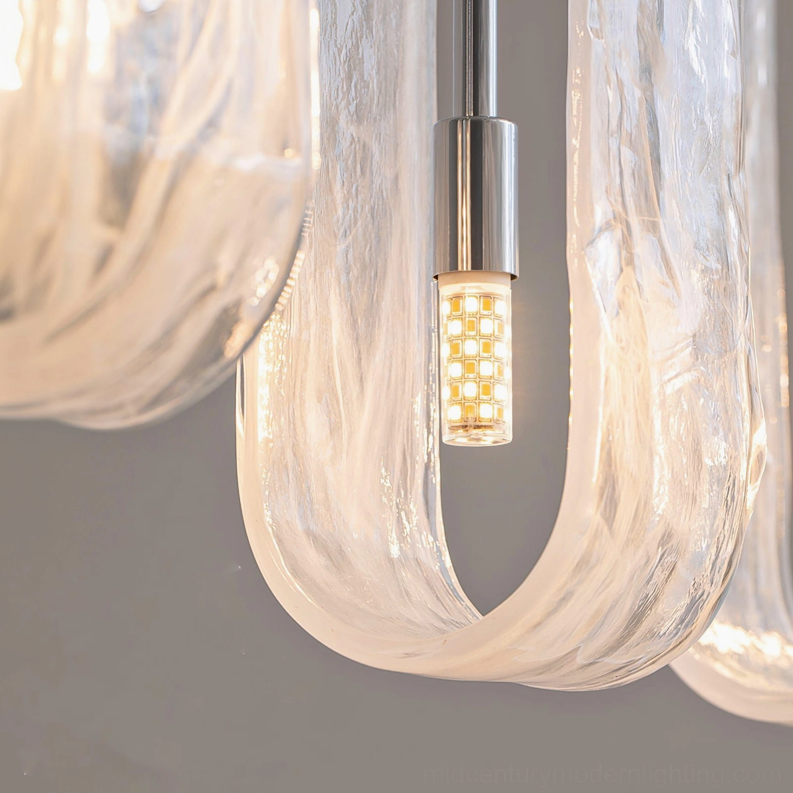 Fontaine sculptural glass chandelier showing individual pendant craftsmanship and waterfall-inspired organic design