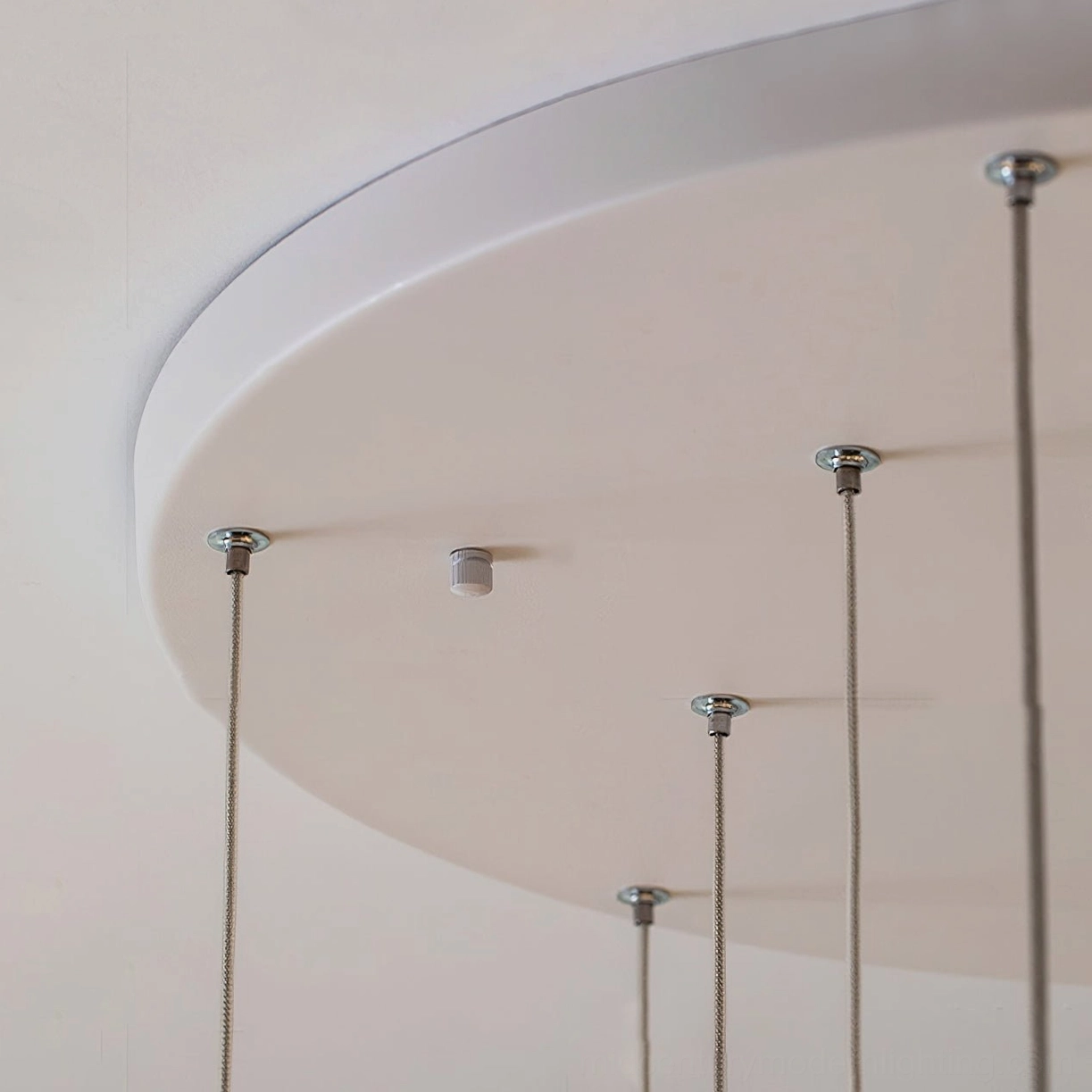 Fontaine cascading glass chandelier in residential installation demonstrating mid-century modern lighting aesthetic