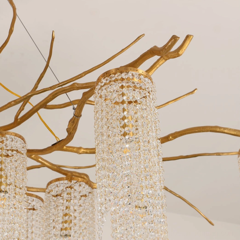 Side close-up view of Forest Dawn Chandelier with delicate gold branch frames and sparkling crystal cylinder shades