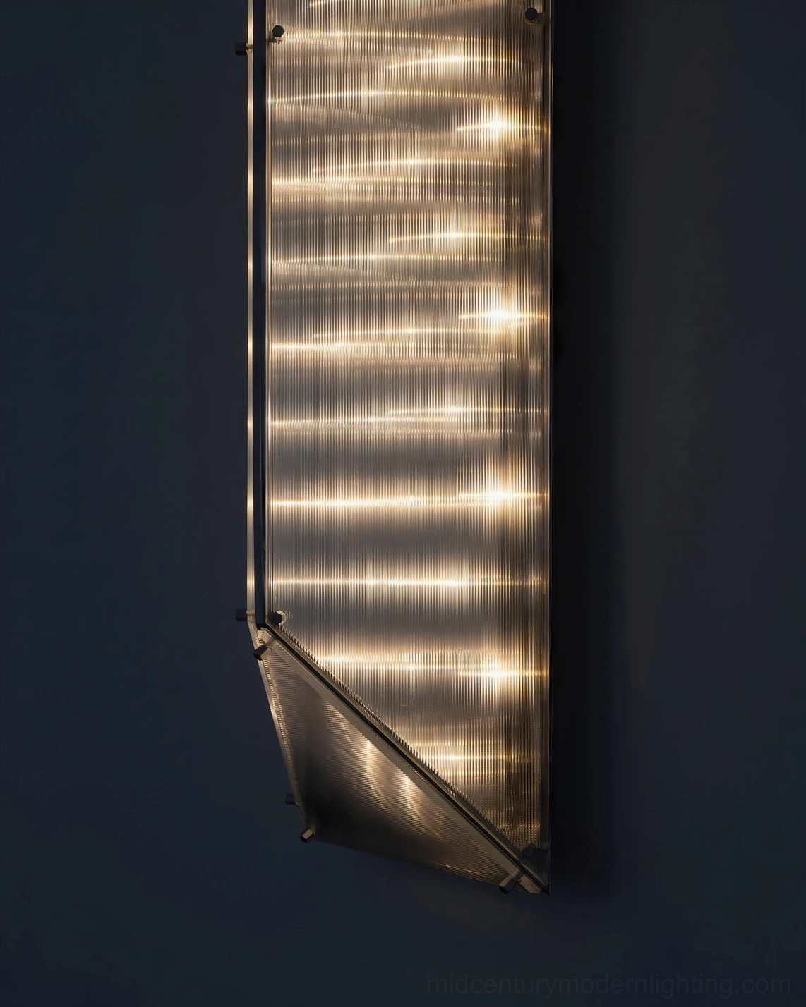 Fragment pleated glass wall lamp close-up metallic frame integrated LED