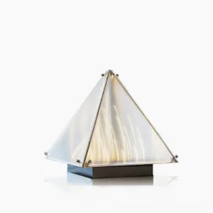 Fragment geometric pyramid table lamp with chrome frame and frosted acrylic shade in studio front view