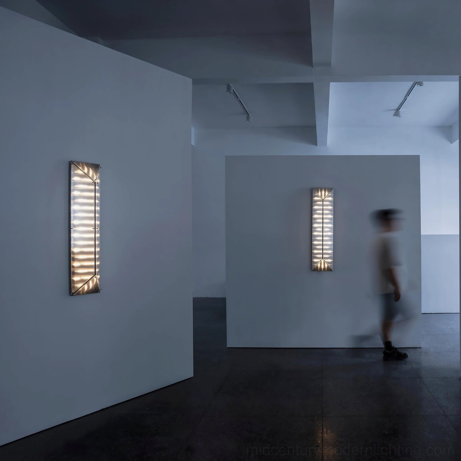 Fragment wall lamp warm ambient glow minimalist exhibition space interior