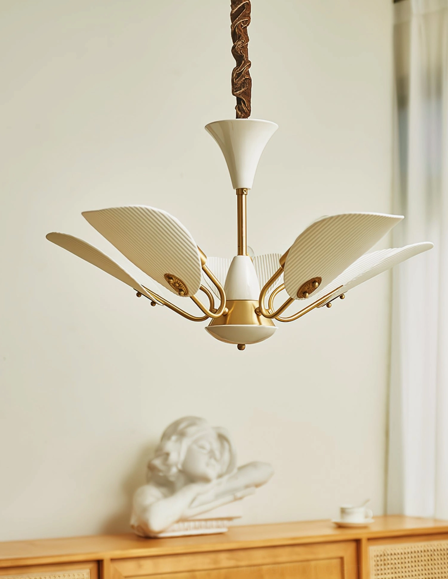 Close-up side view of franco ceramic petal chandelier showing pleated ceramic texture and brass hardware