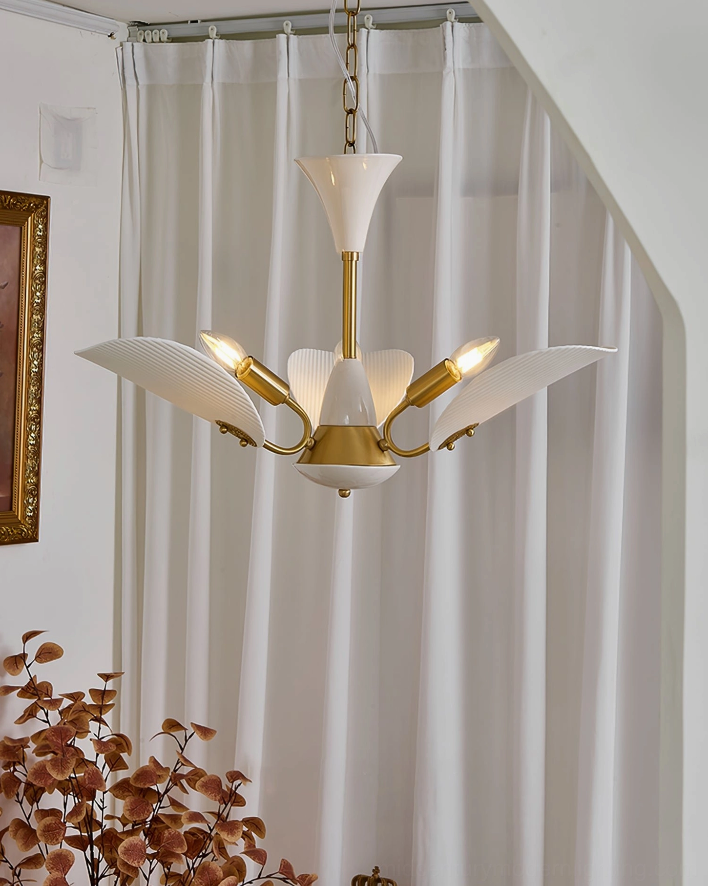 Franco ceramic chandelier low angle view in stairwell with exposed warm bulbs and neutral home decor