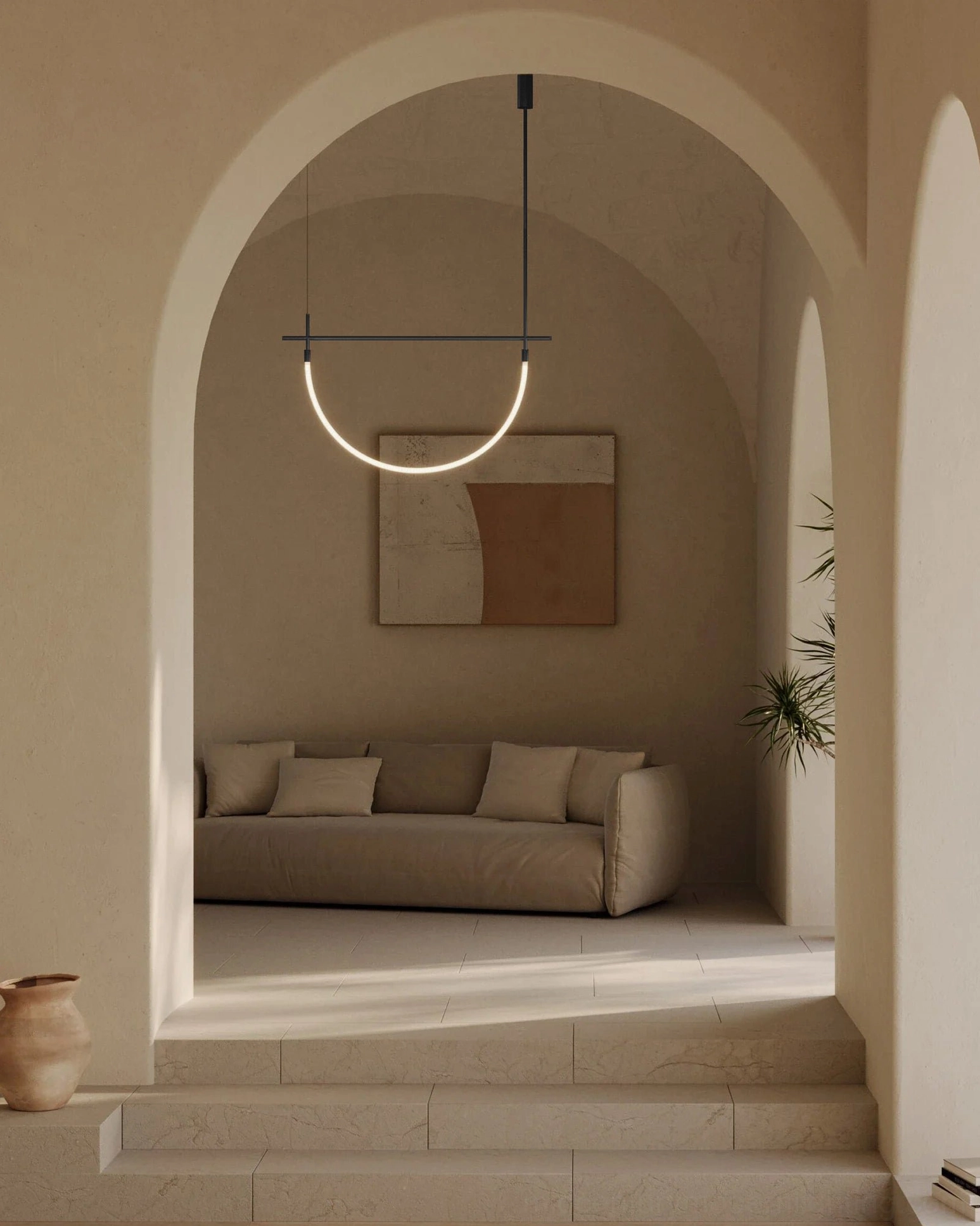 Freja single arc pendant light in contemporary living room with arched ceiling and minimalist warm modern design aesthetic