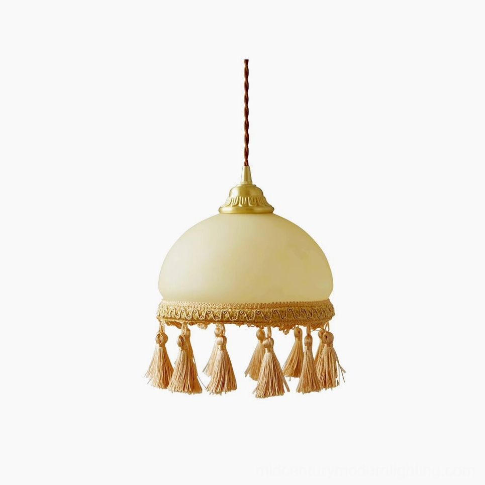 French tassel brass pendant light with embroidered fabric tassels in beige and brown, polished brass finish, studio flat lay front view