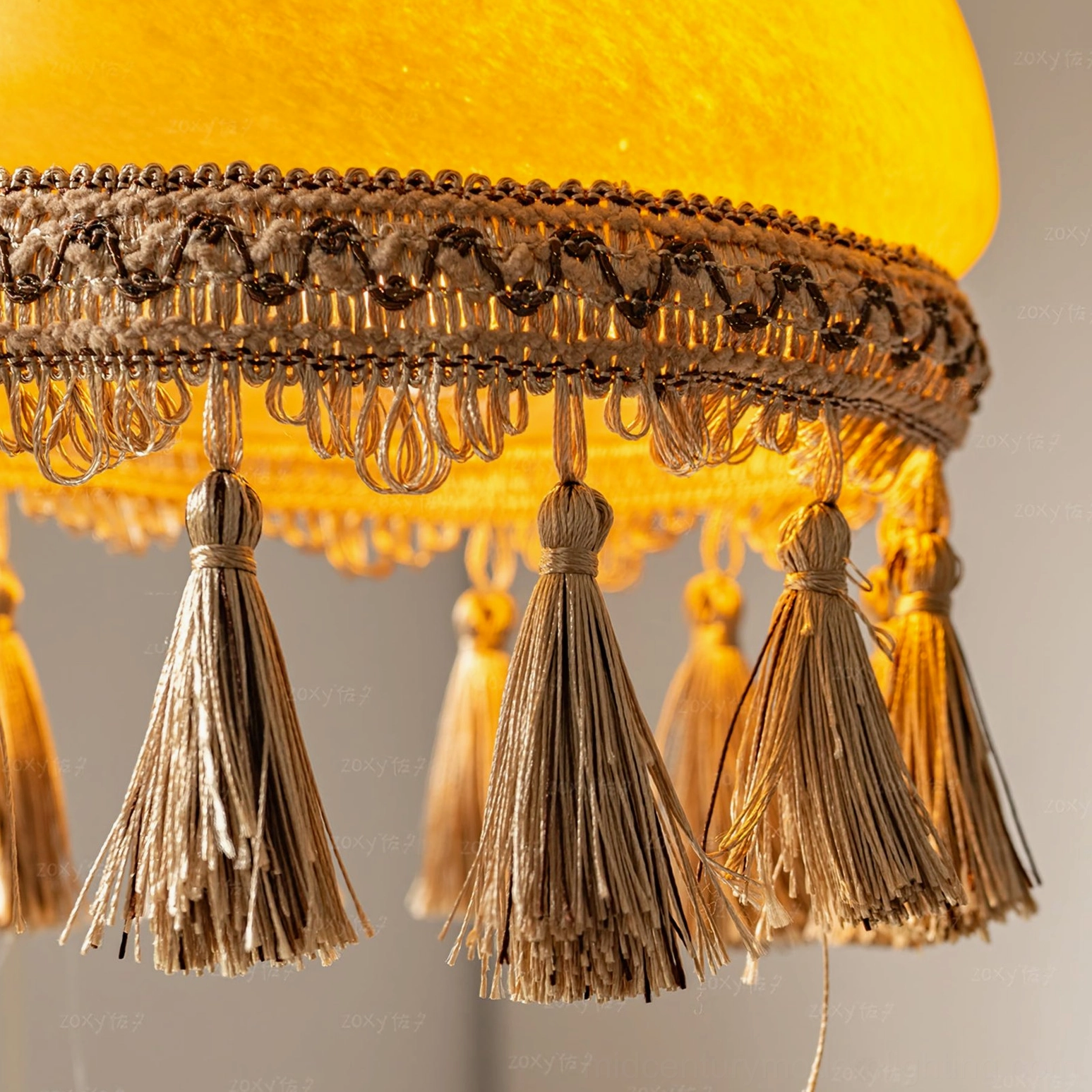 Contemporary room styling with French tassel brass pendant light as focal point above seating area
