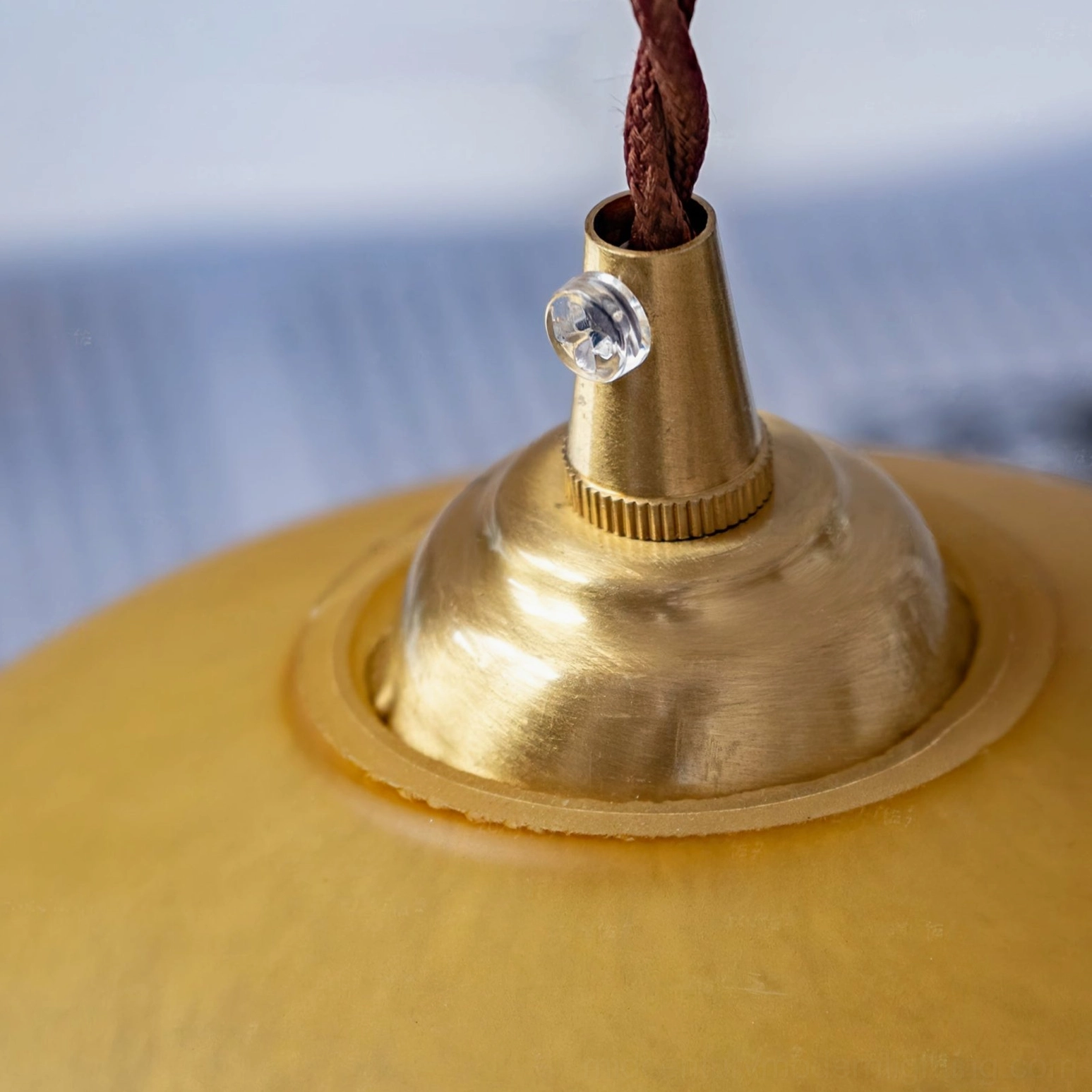 Ceiling mounting adapter and brass crystal fastener detail of vintage French tassel pendant light