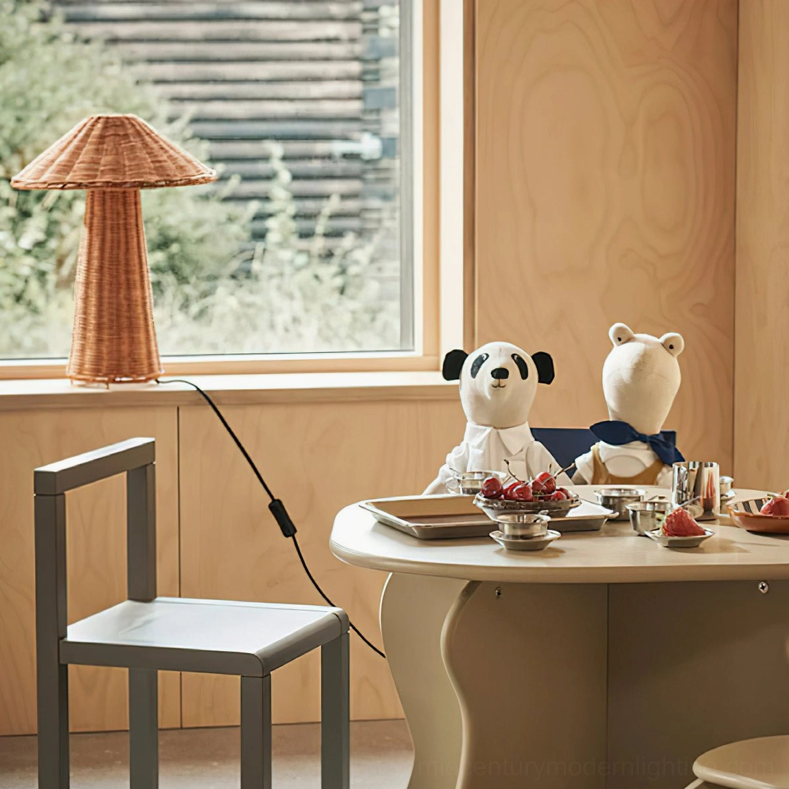 Freya mushroom rattan lamp near window casual dining nook, black power cord visible, warm wood interior