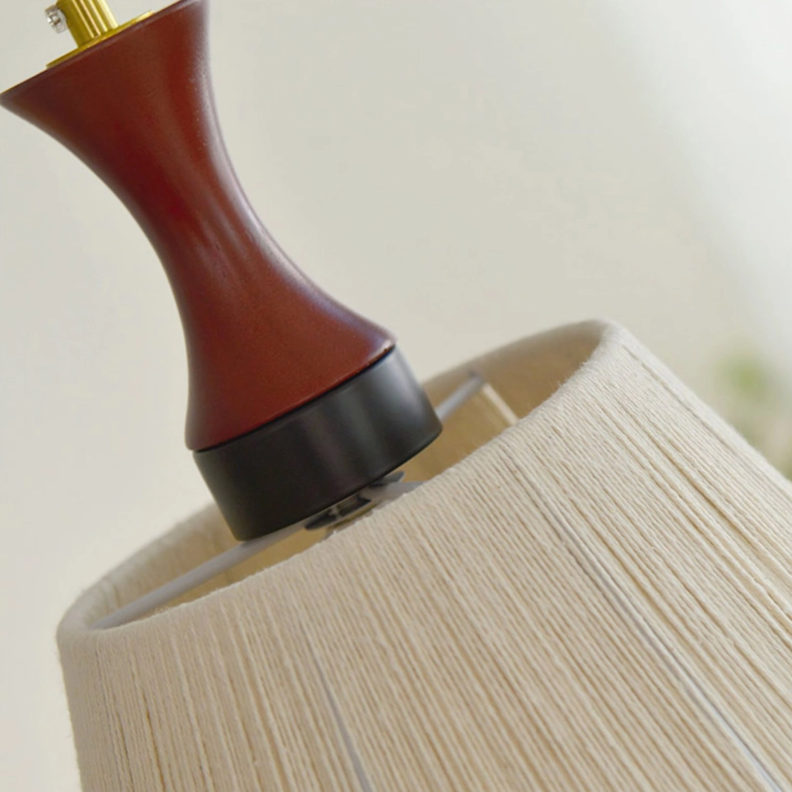 Wooden mounting cap with brass metal fixture of boho fringe pendant ceiling lamp top view