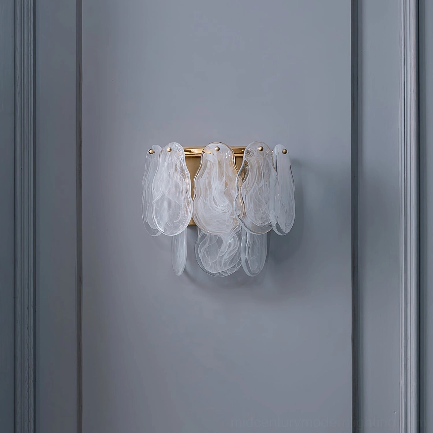 Frosted cloud glass wall sconce mounted in modern interior, front angle showing translucent glass shades and warm ambient effect