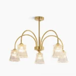Frosted glass cascade chandelier with brass frame in studio lighting, modern luxury aesthetic
