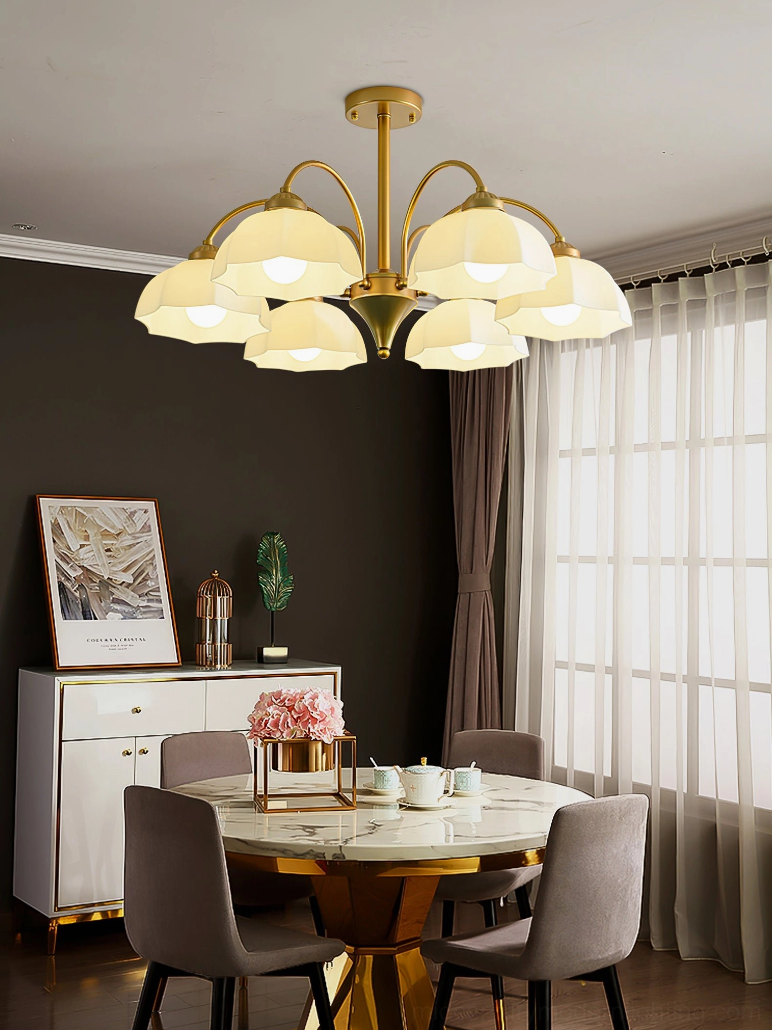 Frosted glass bell chandelier in gold finish, multiple pendant heads showing light diffusion and luxury glass craftsmanship