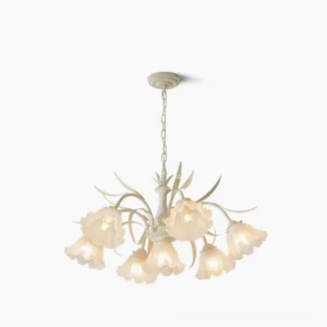 Frosted glass flower chandelier with cream metal frame displayed against white studio background, mid-century modern pendant lighting fixture