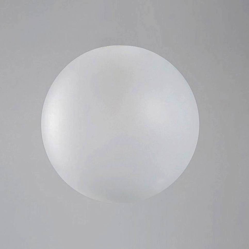 Frosted white opal glass globe pendant light close-up on neutral gray wall background