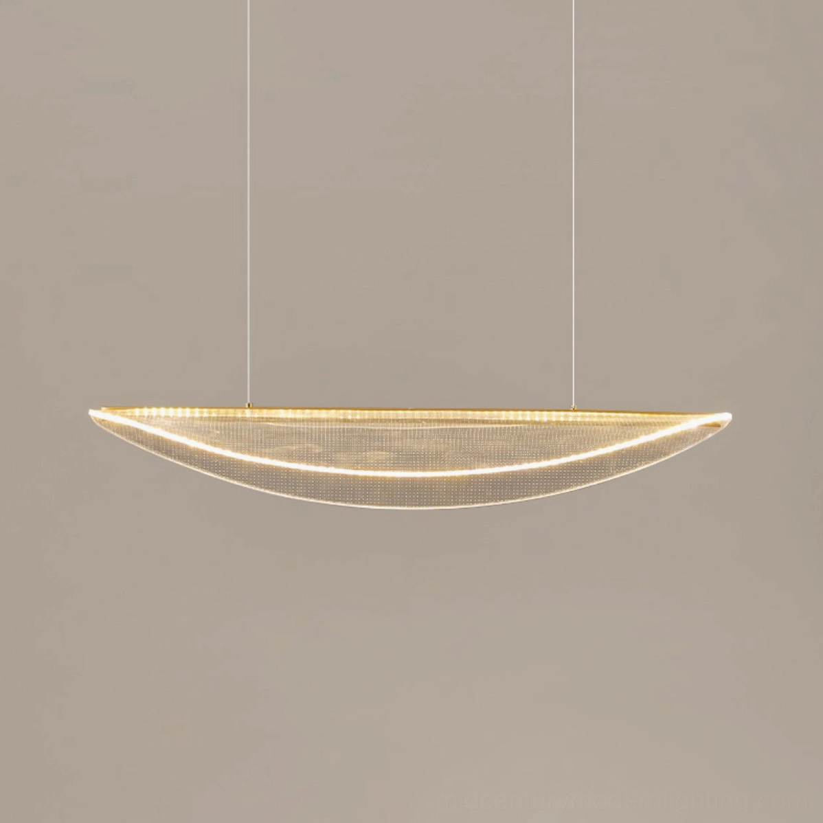Crescent frosted pendant light with perforated shade and gold frame, minimalist lighting design