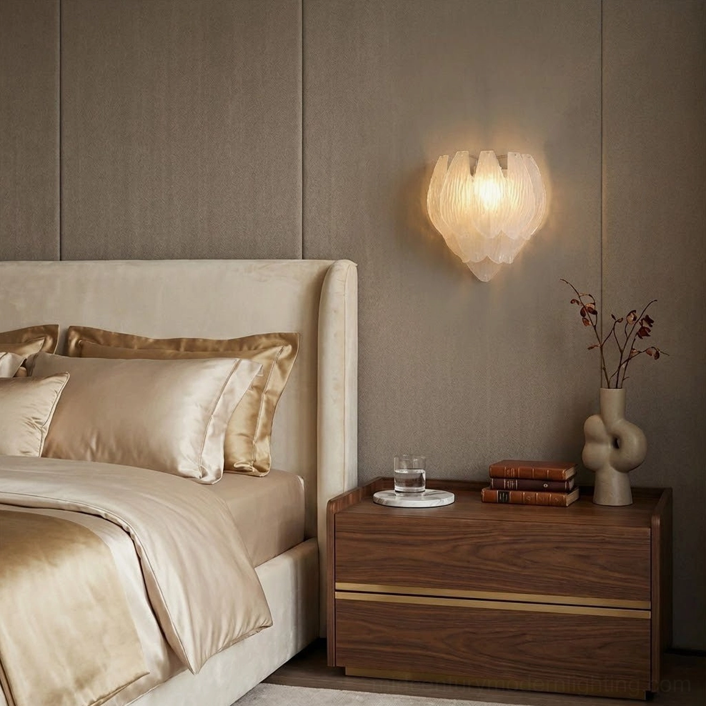 Single frosted petal wall sconce in modern master bedroom beside wood bedside table with warm neutral bedding