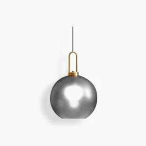 Studio view of frosted smoke gray spherical smoked glass pendant lamp with brass hardware, mid-century modern design