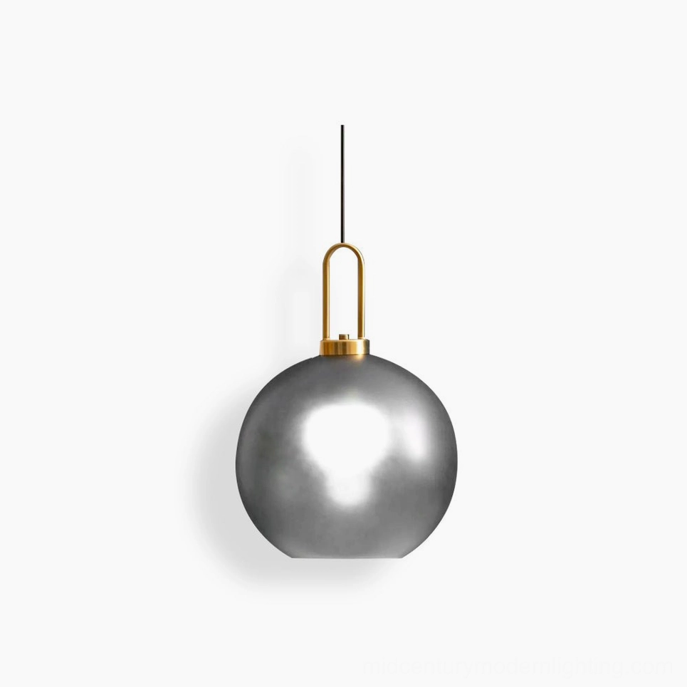 Studio view of frosted smoke gray spherical smoked glass pendant lamp with brass hardware, mid-century modern design