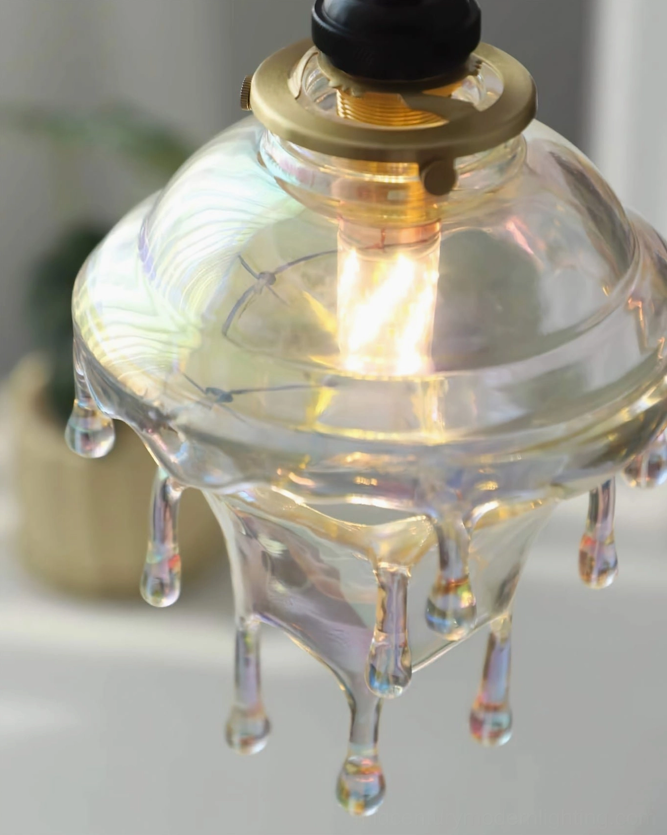 Full view of water droplets resin pendant lamp with brass hardware and fabric cord