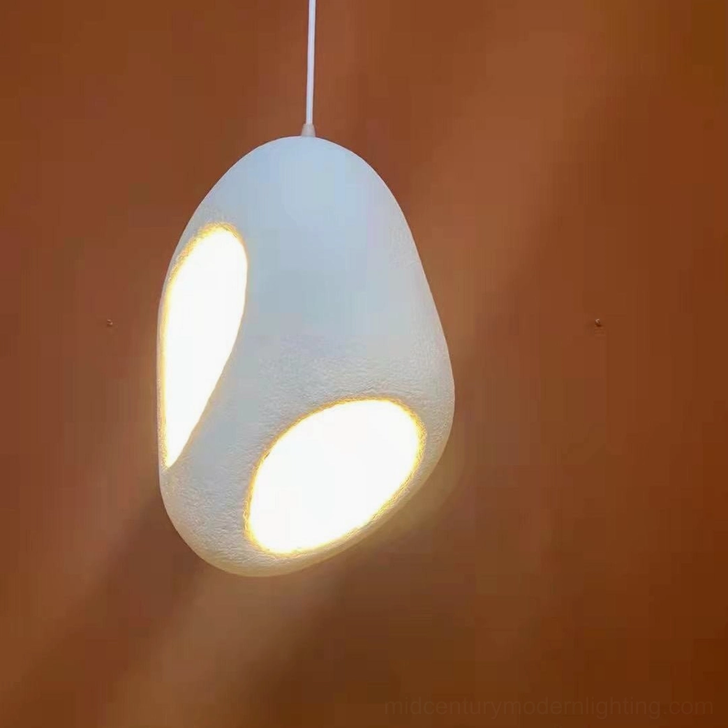 Fulvia pendant lamp close-up white matte texture warm internal glow detail shot