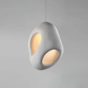 Fulvia modern pendant light side angle 3/4 view warm glow cutout design contemporary