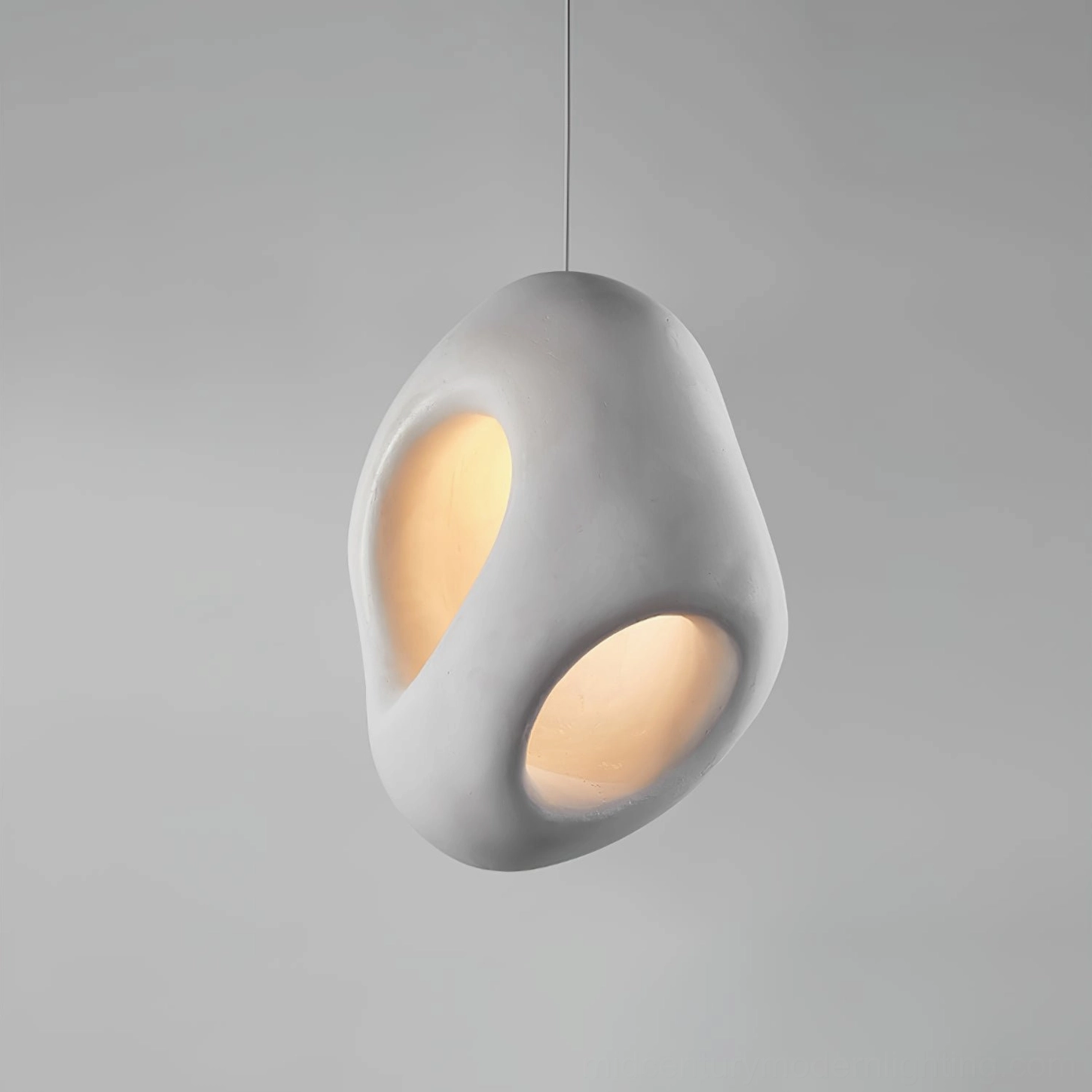 Fulvia modern pendant light side angle 3/4 view warm glow cutout design contemporary