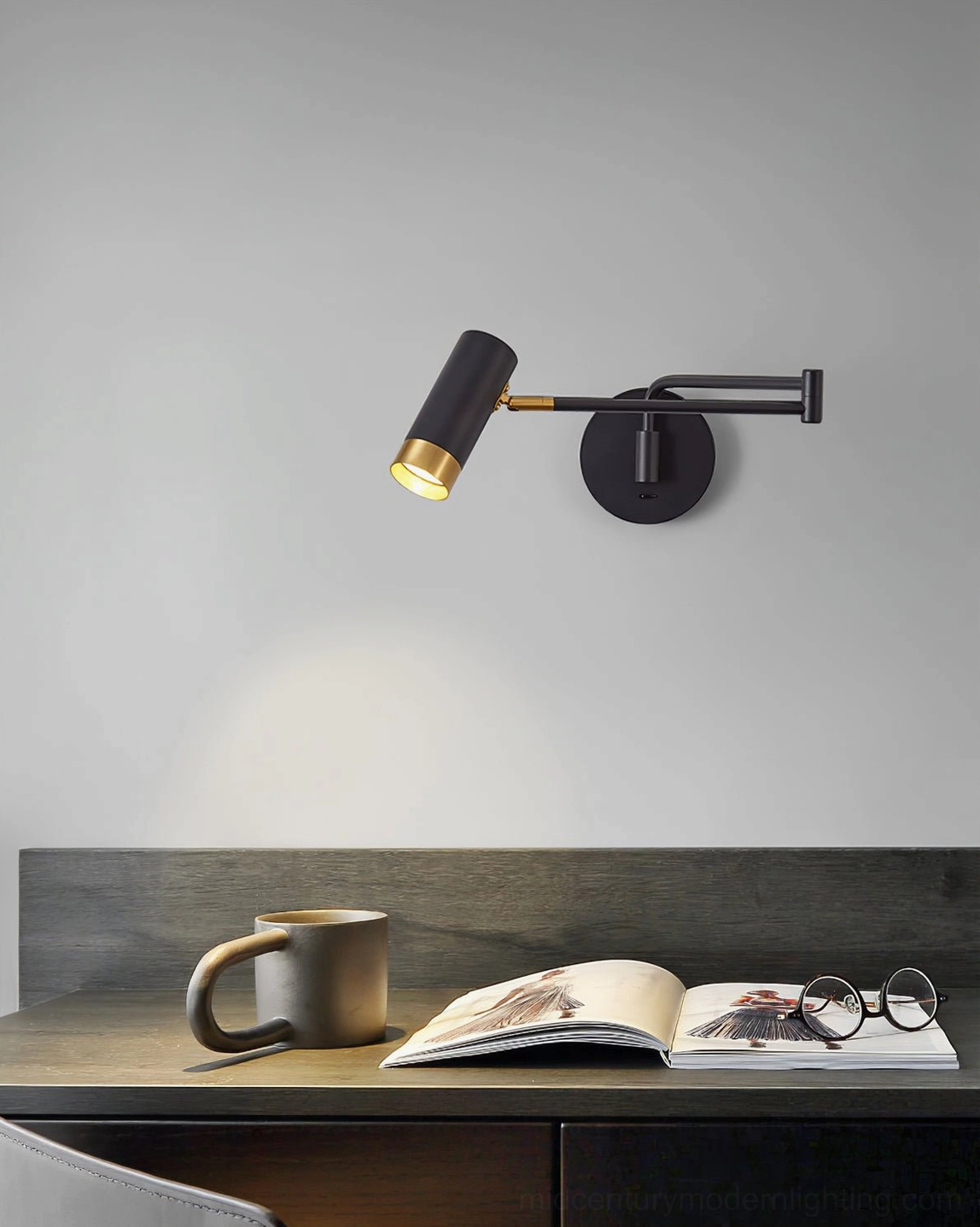 Detailed view of Fumi swing arm wall lamp showing articulating poles and metal construction