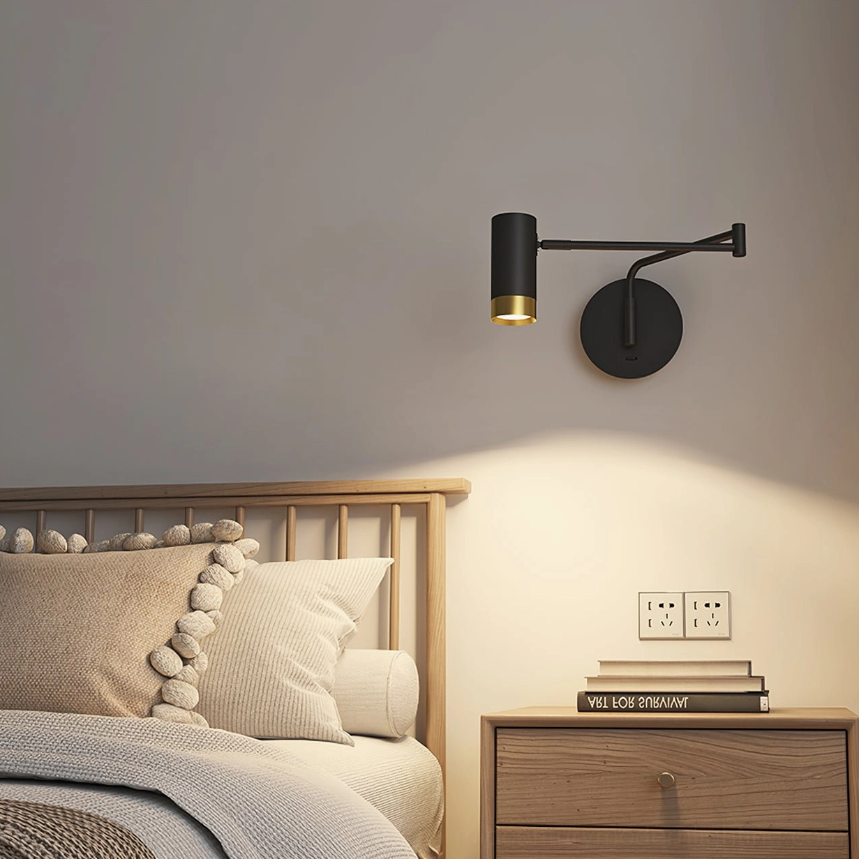 Black and gold Fumi swing lamp providing sculptural accent to contemporary bedroom wall