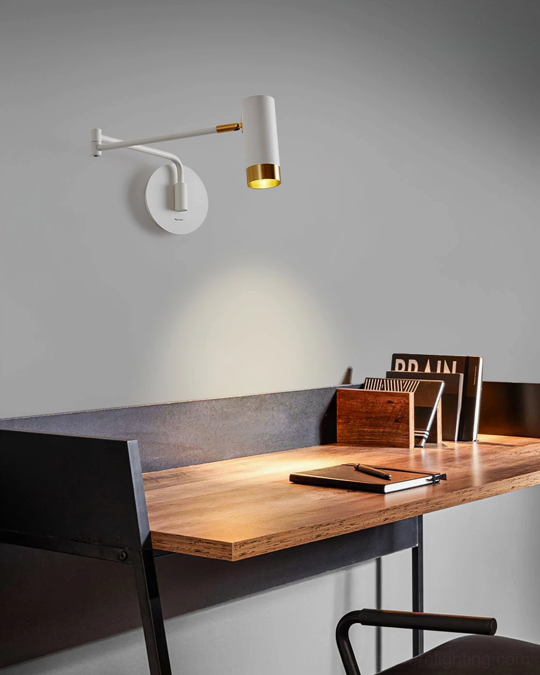 Fumi swing arm sconce in Scandinavian home office workspace with minimalist aesthetic