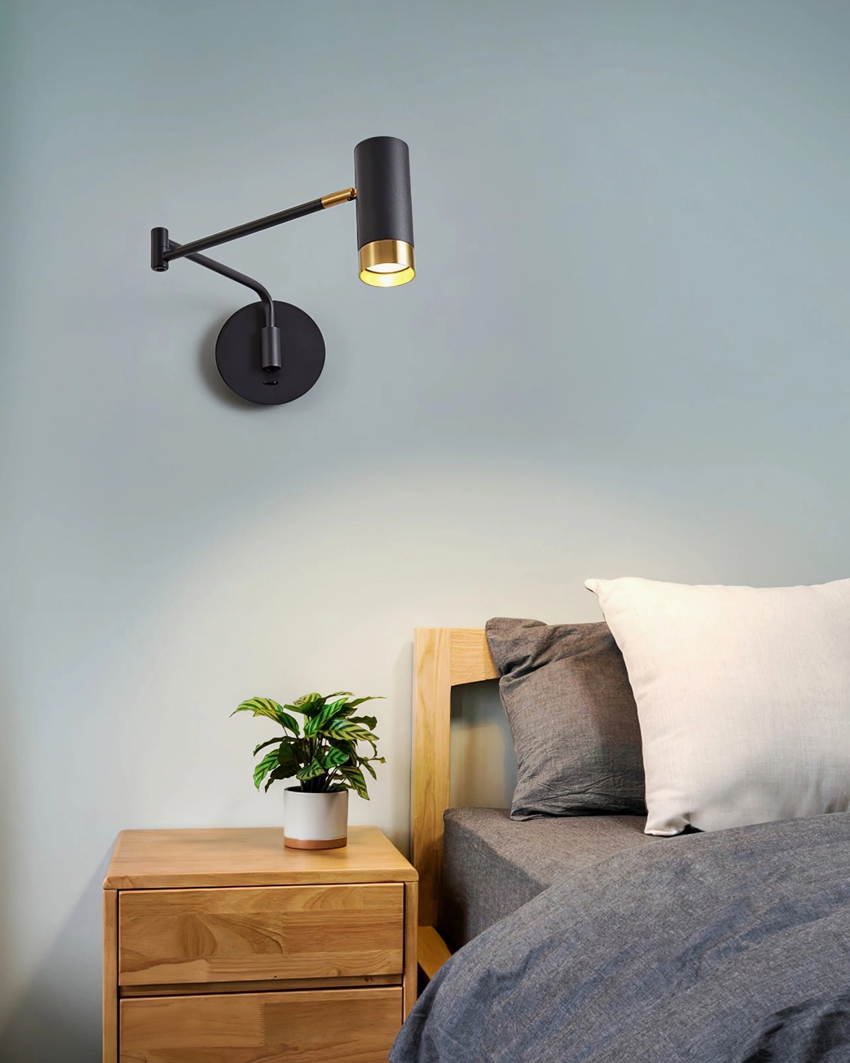 Full product shot of Fumi swing arm wall light showing compact footprint and elegant proportions