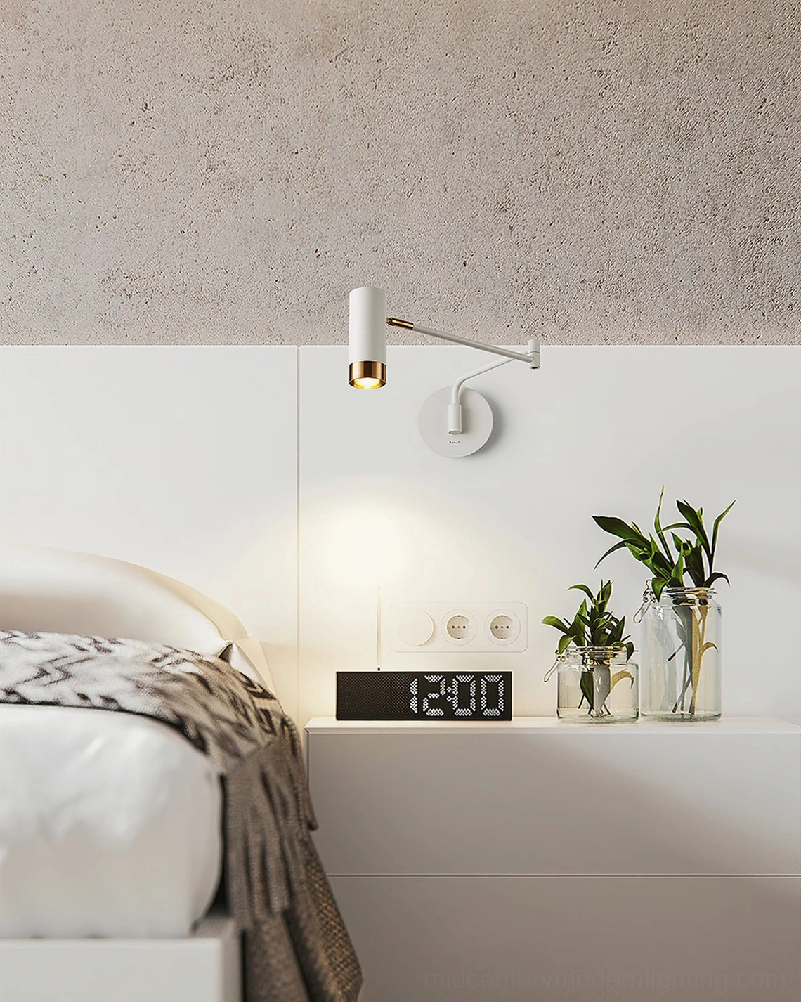 White and gold Fumi articulating wall sconce installed in minimalist bedroom above bedside table