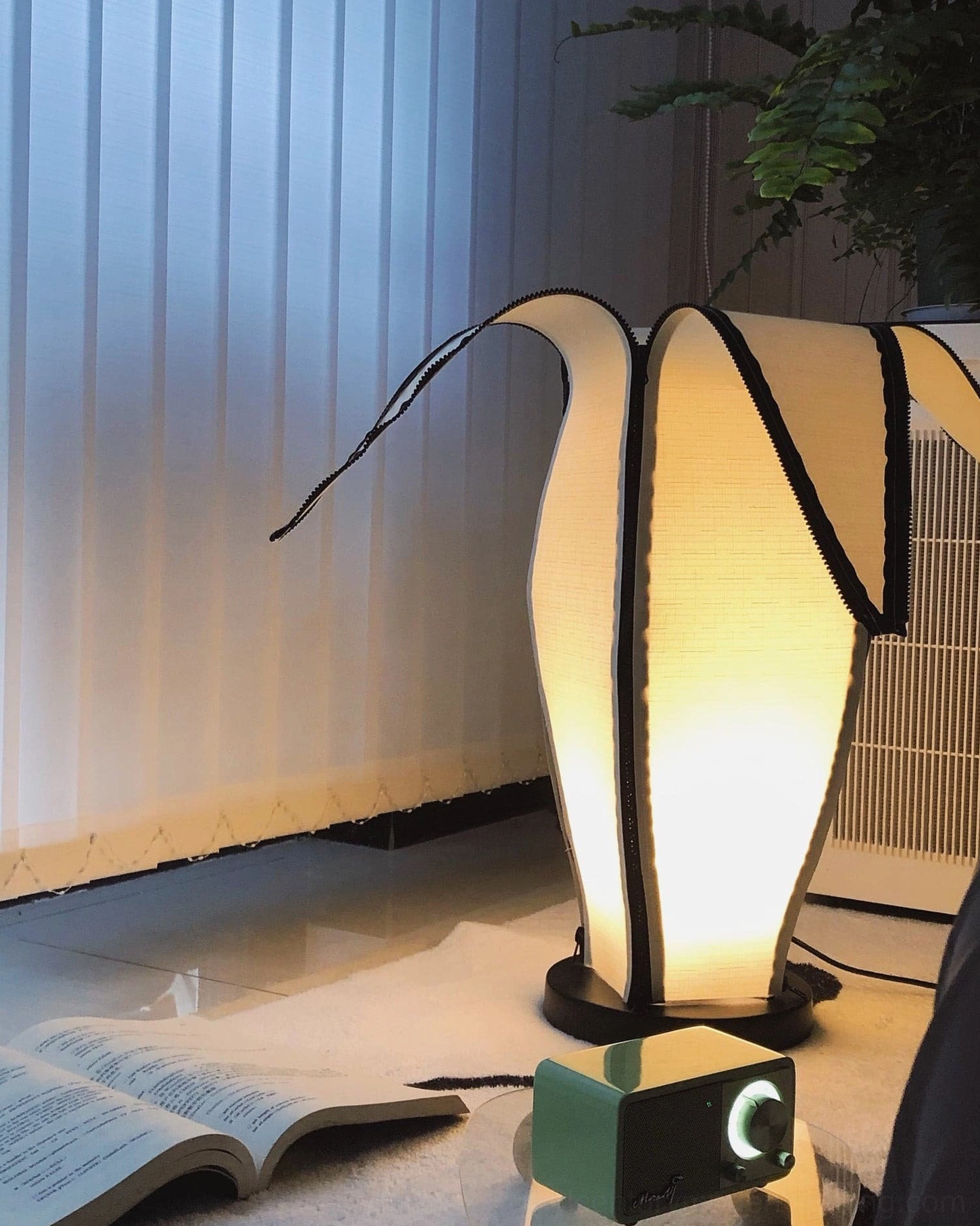 Functional sculptural banana table lamp for reading corners and accent lighting placement