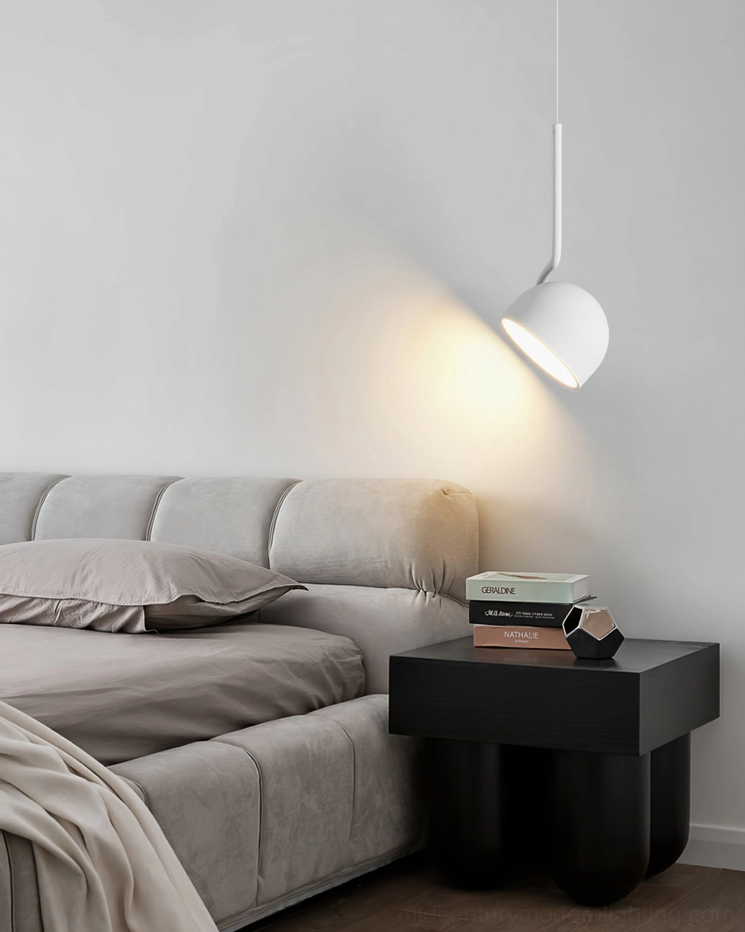 Furoku white pendant light installed in minimalist bedroom with sofa bed, Nordic design aesthetic