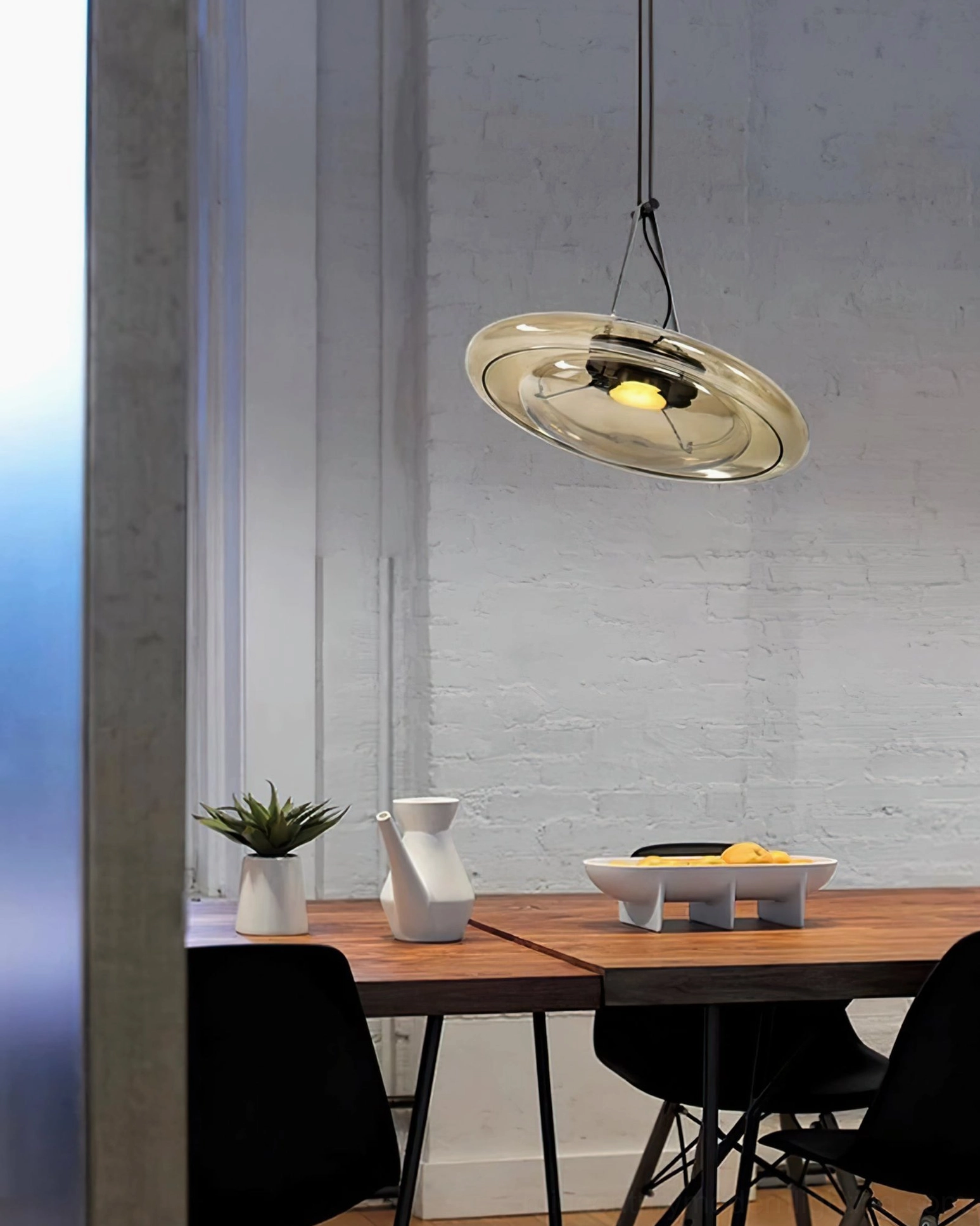 Futura mid-century modern pendant light fixture showcasing warm cognac glass and leather cord design